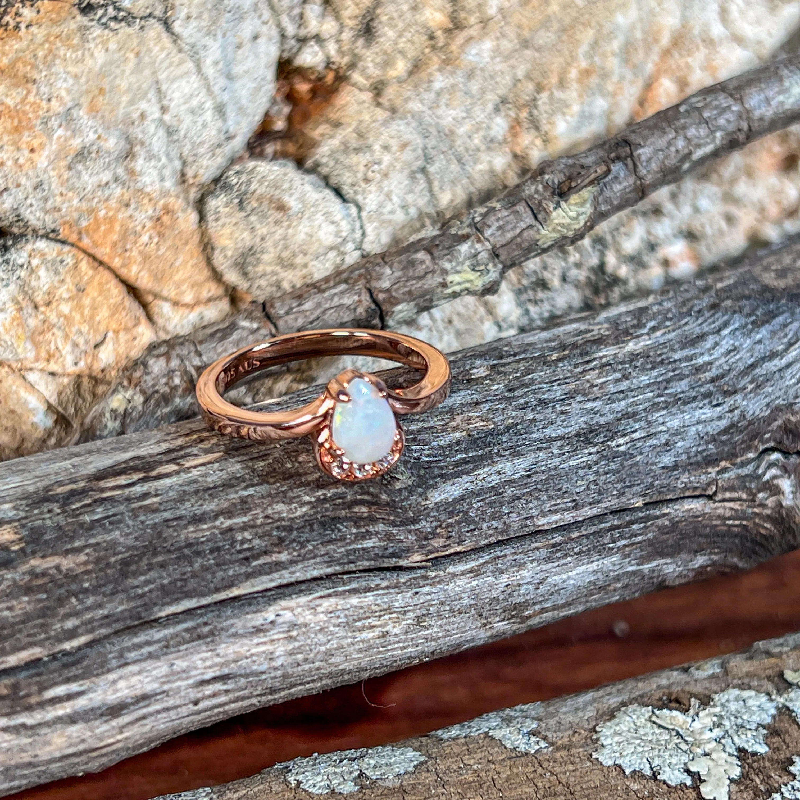 Rose Gold plated silver ring with one 7x5mm White Opal and cubic zirconia