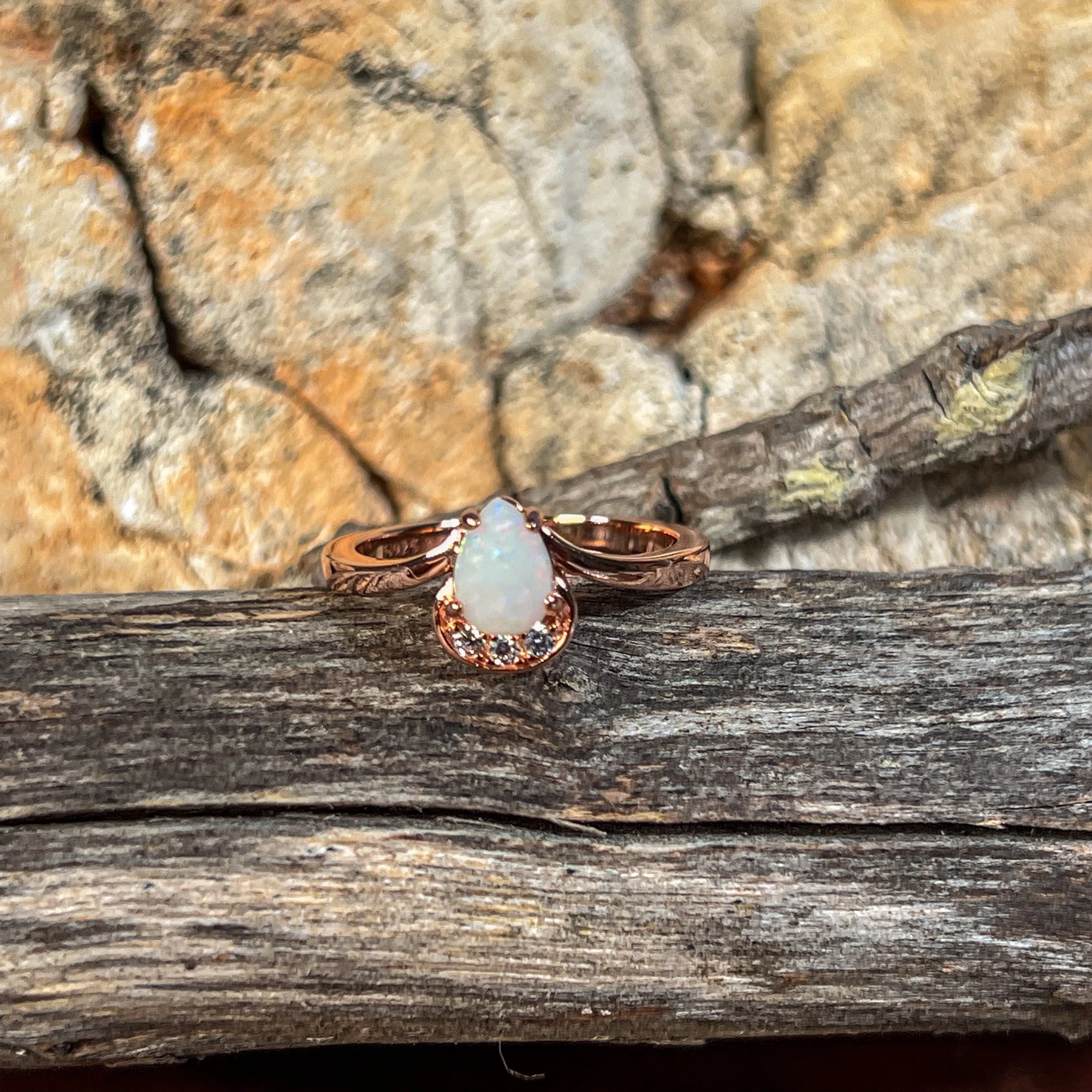 Rose Gold plated silver ring with one 7x5mm White Opal and cubic zirconia