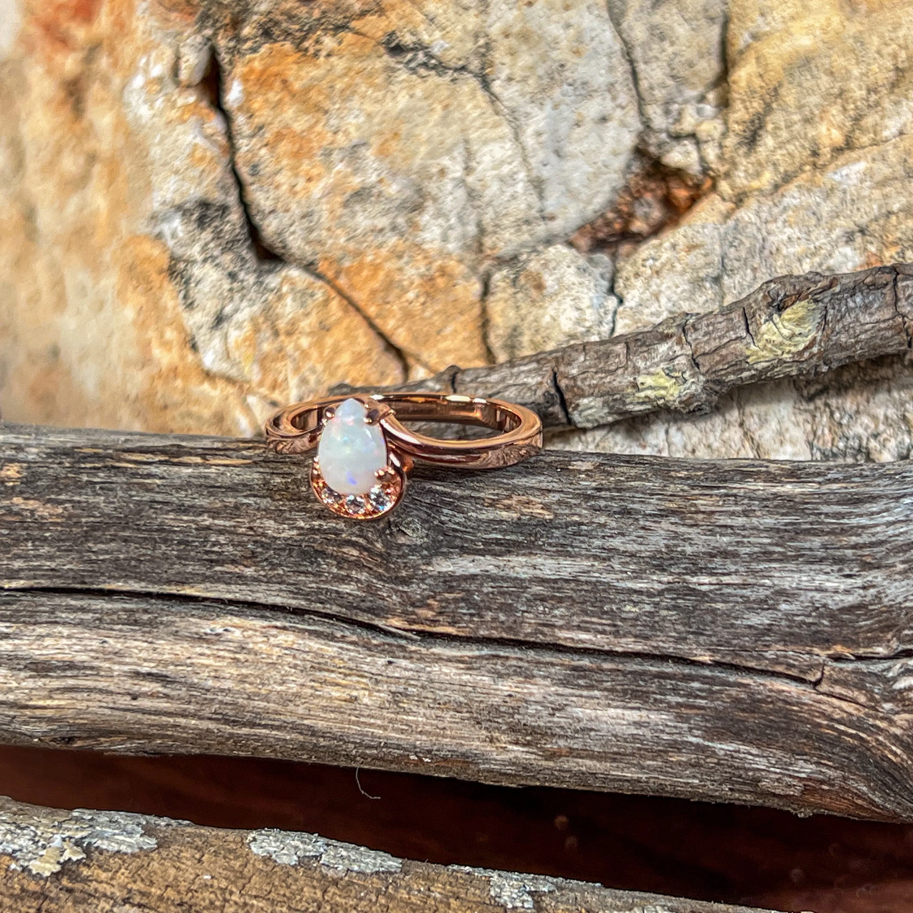 Rose Gold plated silver ring with one 7x5mm White Opal and cubic zirconia