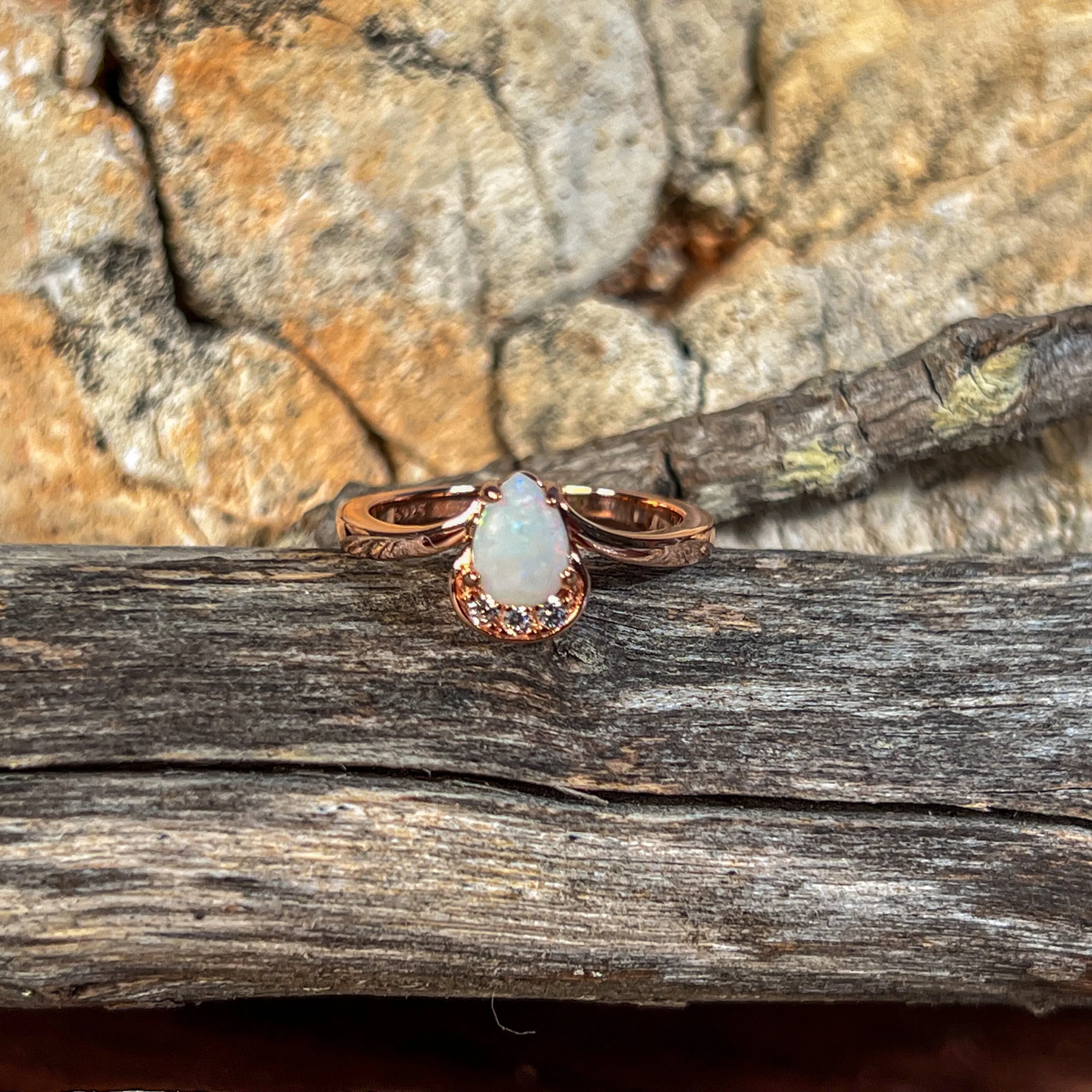 Rose Gold plated silver ring with one 7x5mm White Opal and cubic zirconia