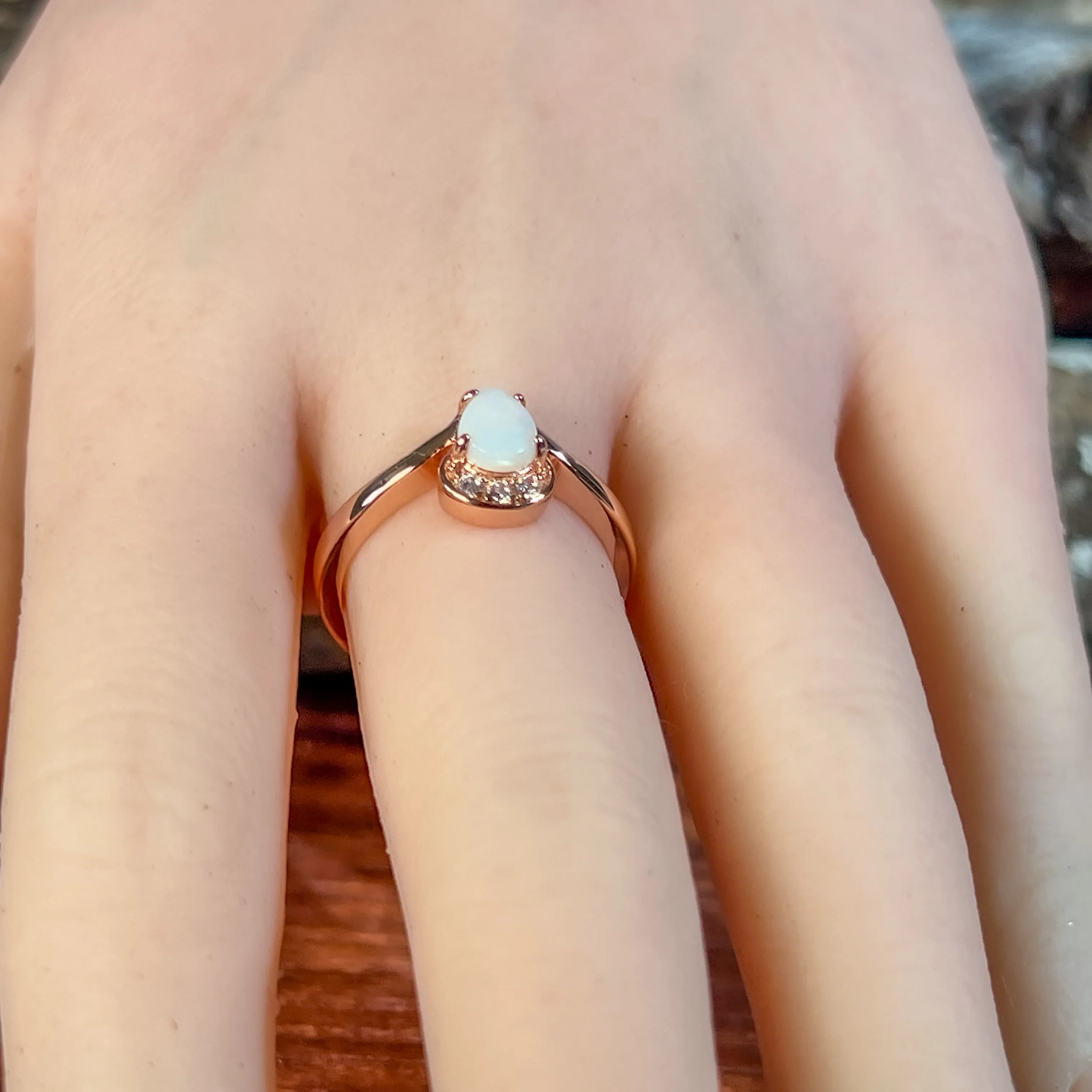 Rose Gold plated silver ring with one 7x5mm White Opal and cubic zirconia